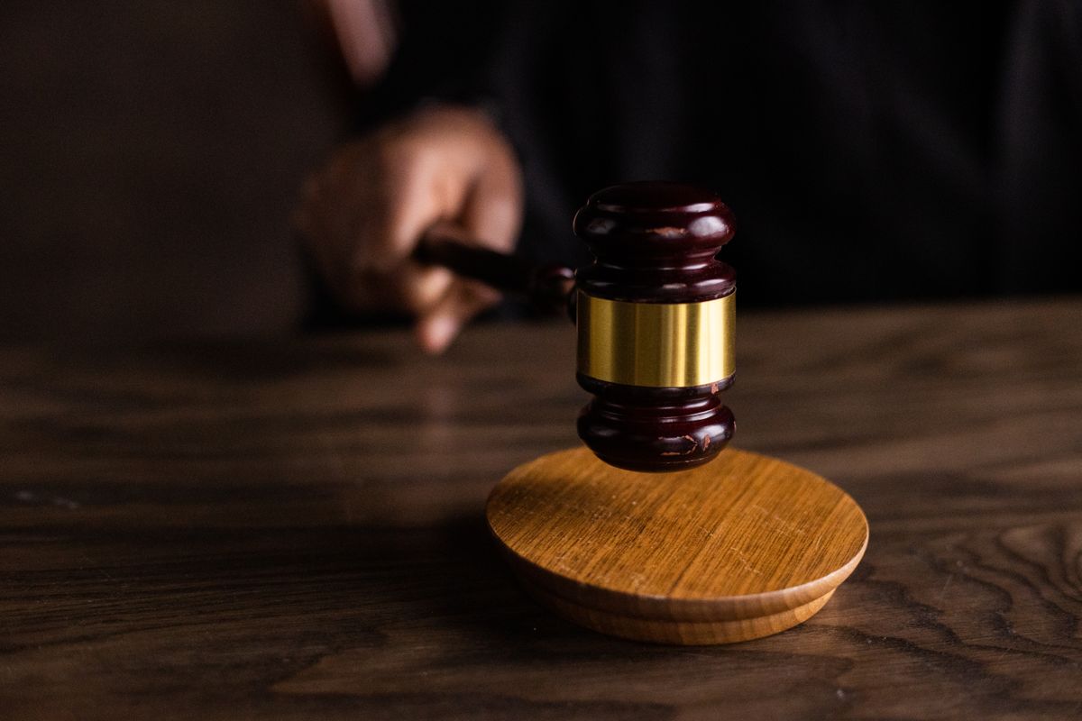 A judge’s gavel on a wooden desk